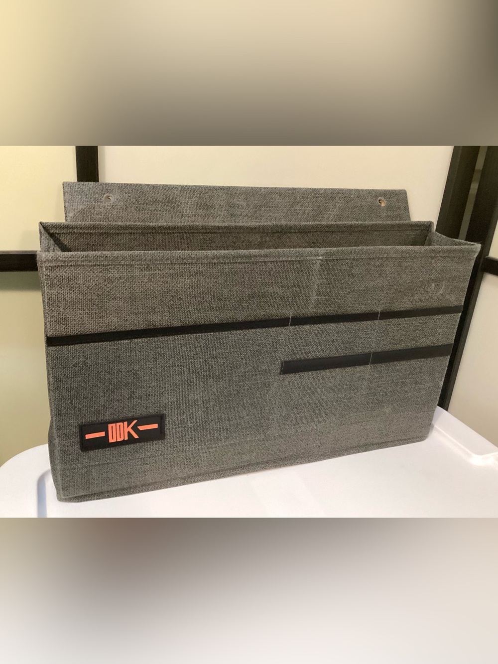 Desk side hanging organizer storage bag with 3 pockets.